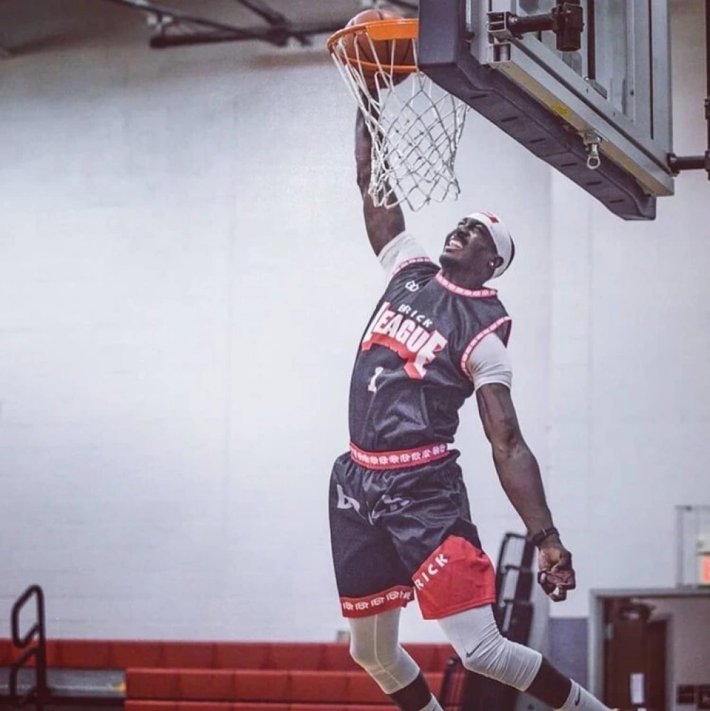 Player Holding Wooter Custom Game Basketballs