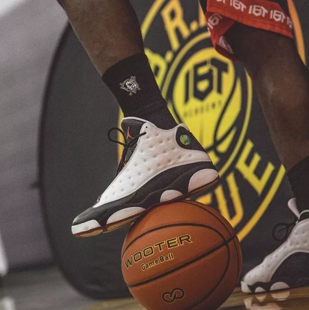 Player Holding Wooter Custom Game Basketballs