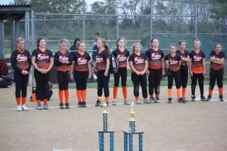 Team Force wearing Wooter Custom Lightweight V-Neck Baseball Jerseys in black and orange design