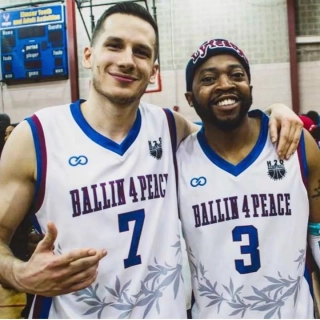 Players wearing Ballin 4 Peace- Blue and White Custom Basketball Jersey